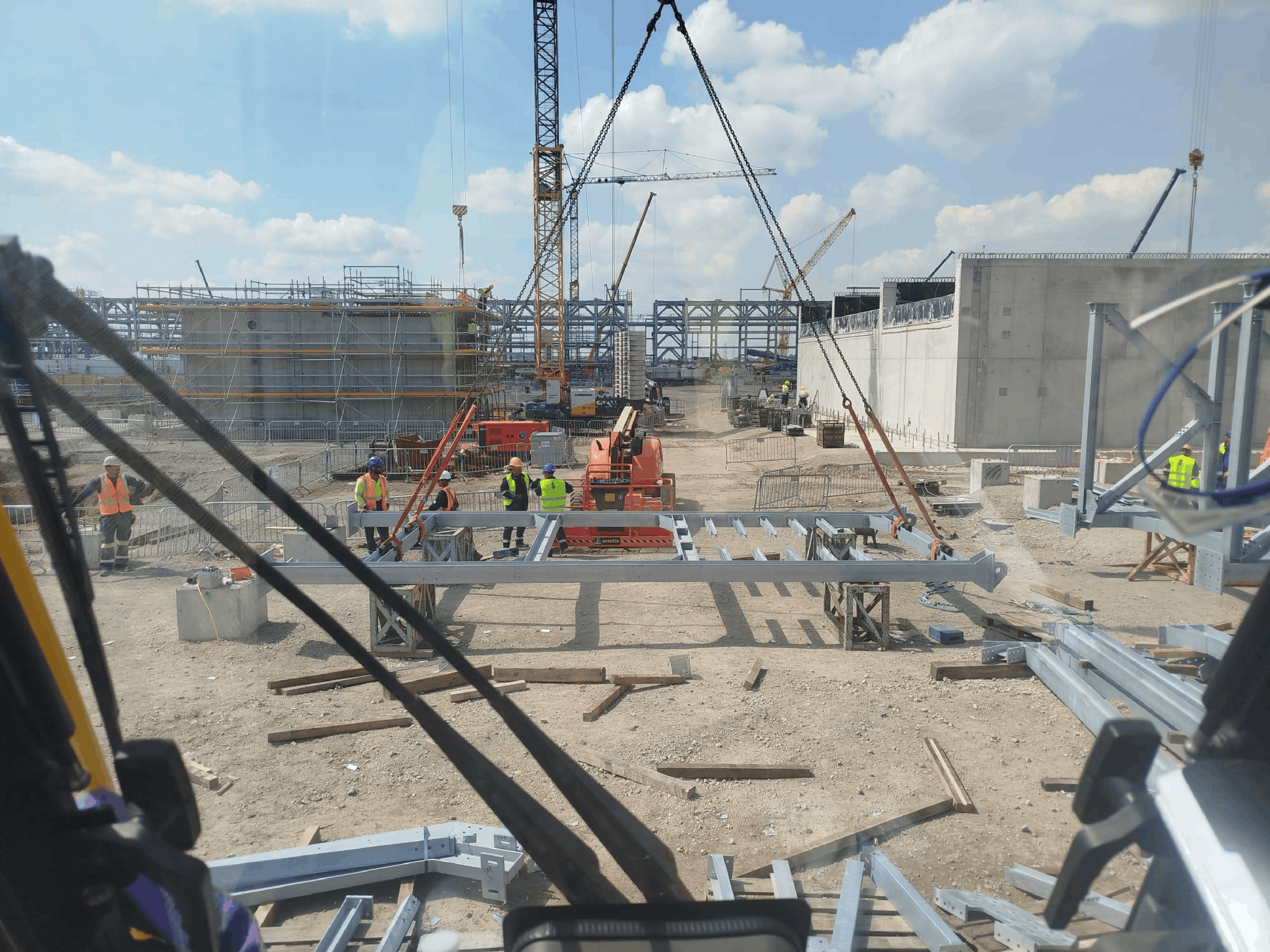 SITS field team coordinating multi-crane operations at large industrial construction site